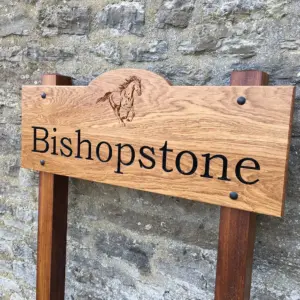 bow top wooden house sign